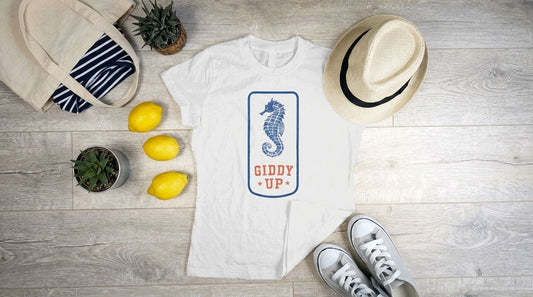 Coastal clothing for a weekend bag: tees, hats, and totes